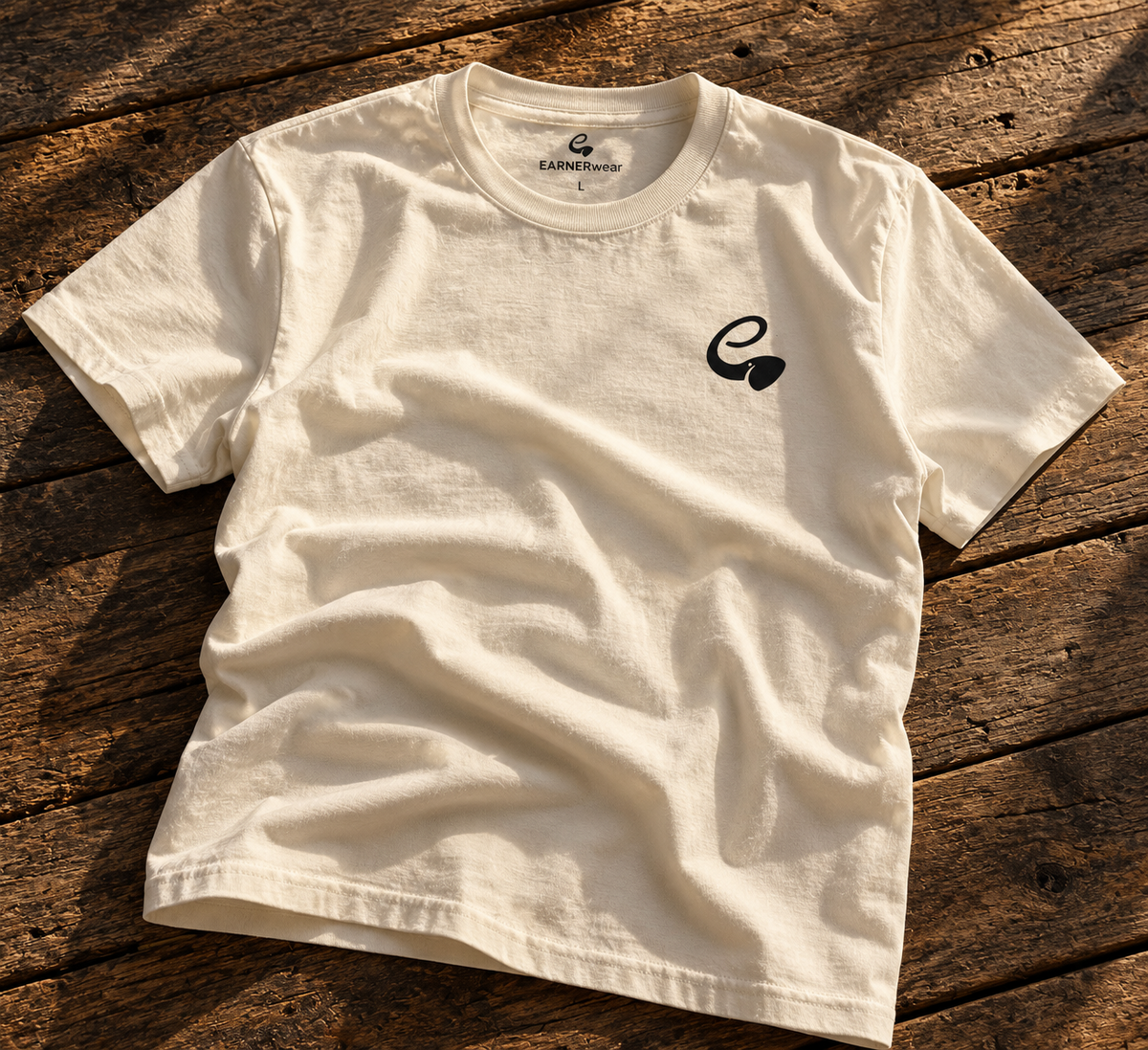 EARNERwear shirt lifestyle flat lay on rustic wood background